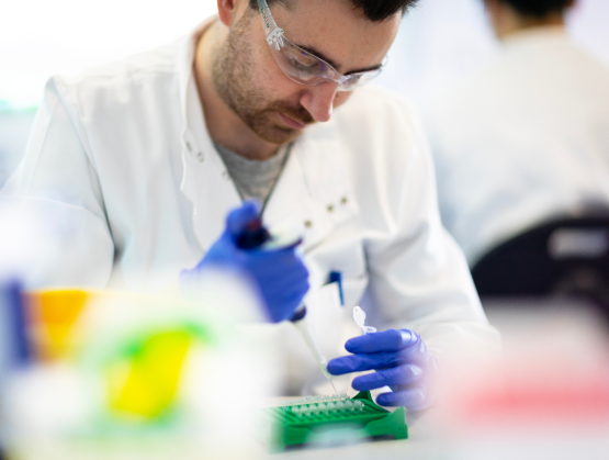 Scientist using a pipette